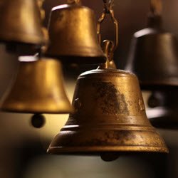 Photo of hanging brass bells